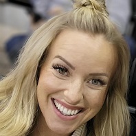 A woman with blonde hair and a smile.