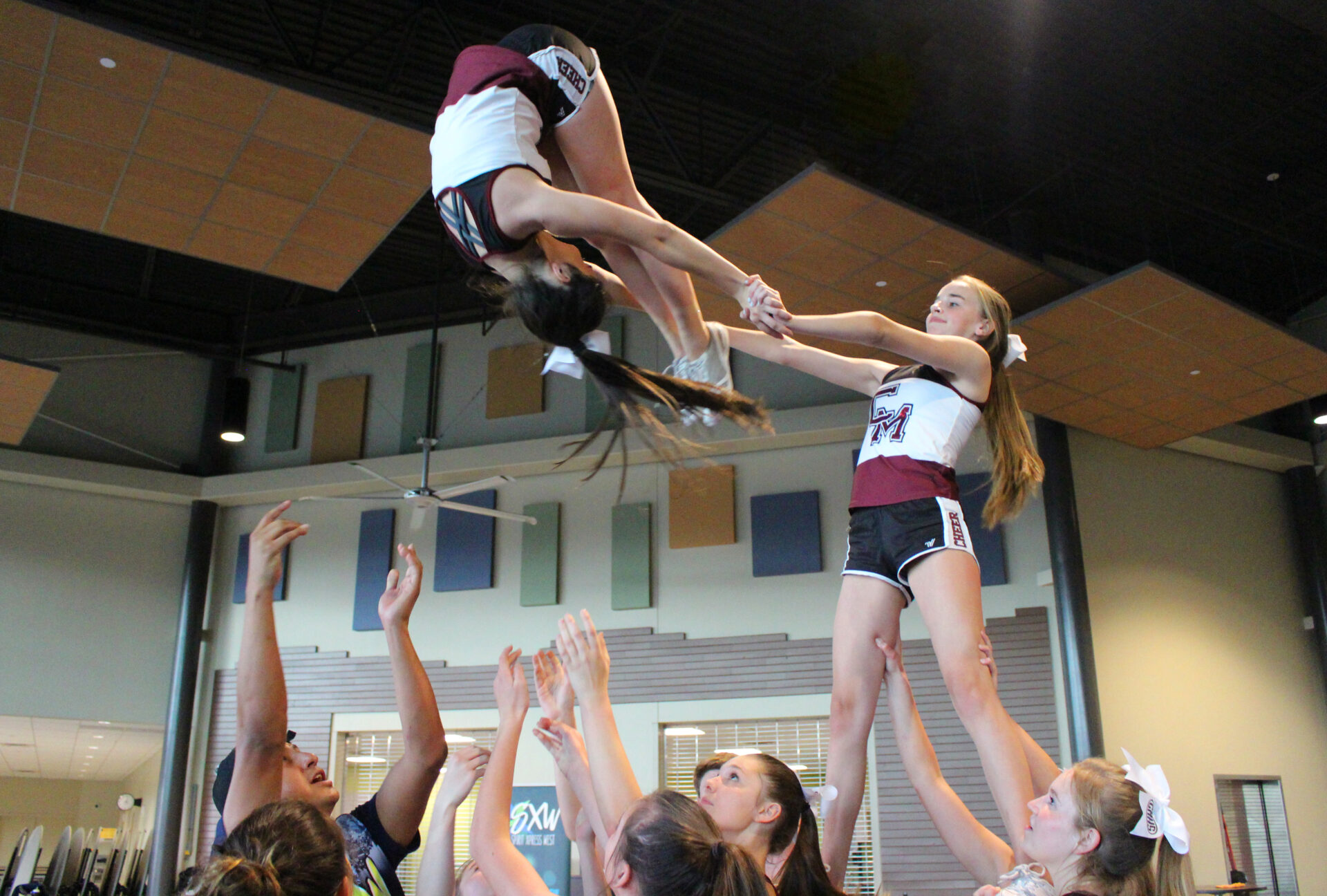 A group of people that are doing stunts on some kind of device